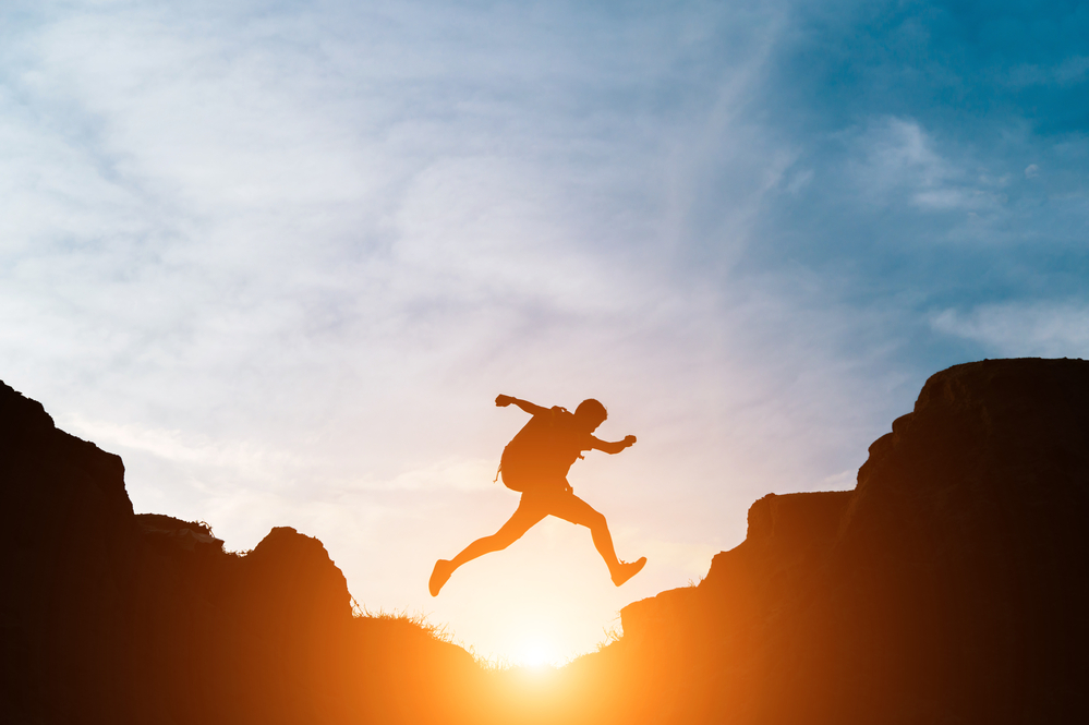 man jumping over a gap representing the value gap